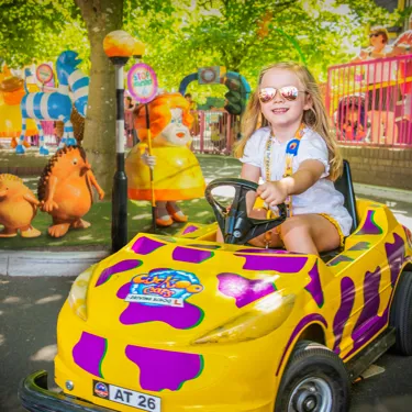 Cuckoocars Girl driving yellow and purple car