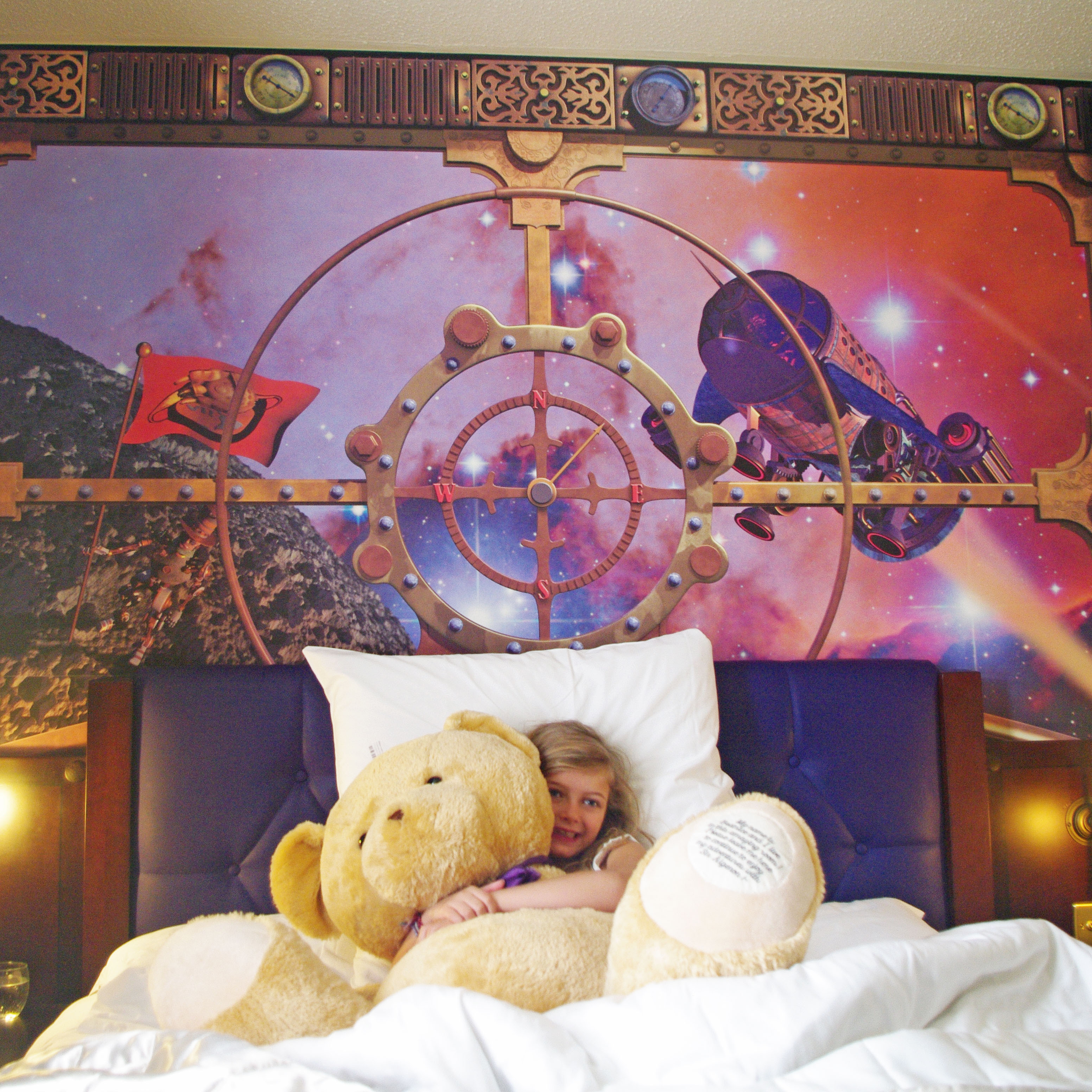 Moon Voyager Room - girl cuddling teddy
